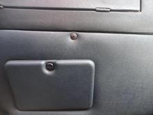 Looking up at the fuse panel cover