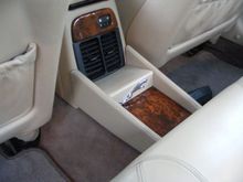 I had put the console extension in last winter, (just sitting in place wedged between the console and rear seat bottom...); I picked up some stick on leapers from Ebay...thought it looked ok here, since I don't have heated rear seats...and recovered that mounting piece for the switches.  Adds a little pizzaz, no?