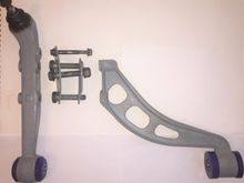 Lower wishbones with new ball joints. These take all the weight of the car and tend to go before the upper ball joints. Wire brushed and coated with Zinc primer. 2-Part epoxy mastic topcoat. Polybushed