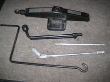 Trunk tool kit- jack, crank, lug wrench, spark plug wrench and bag- $100