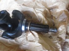 Oil seal track (large silver item, and endfloat spacer shim the brass-coloured item in the driveshaft, though it is not made of brass)