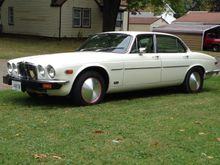 Full Moons with  Dzut's fasteners on red rims.  Rear rims widened for the 235 60 15 Street Slicks