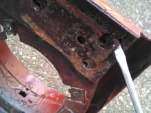 Limp hinge side exhibits rust, cracking which might explain the hanging uneven issue. Altho hinge on this side is also not sitting tight.
