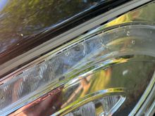 This closeup does show a line of adhesive around the clear layer. 