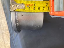 The tool is about 2.6 inches in depth on its own.