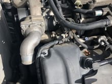 Part of the radiator hose connection to the supercharger is out. 