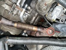 This damn stud (circled) to the EGR pipe broke off. If I could just remove the bolt on the other side, I could remove the EGR pipe and then work on removing that stud. 