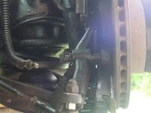 Is it the Long Bolt in the Pic that has the Shims?
If so which side of the Caliper do they go.
Between The Caliper and the Steering Arm
Or the The Caliper and the Strut?