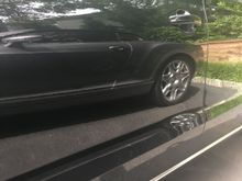 You are looking at my Audi A8 front door, that had ceramic applied. The reflection is my Bentley GTC. 