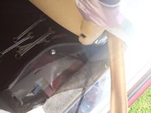 The Handbrake Adjustment Rod is just behind the Drivers Seat underneath the Carpet Trim and can be a bit hard to find