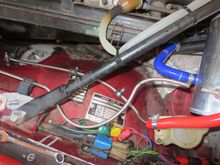 Stainless tubes, one from the rad bleed, one to the atmo tak.