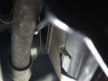 Undoing the Jubilee Clip on the Bottom Hose with the long extension Wrench shown in the previous pic.