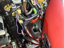 This is under driver side dash.   Unconnected black wire from center counsel that looks like it’s in the vicinity of the ac controllers.   There are two black wires.  One goes to the light switch.  The loose on is shorter and I don’t see anything in the area that would accept it.  Any ideas what it is ? 