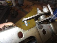 Close up of stud that the CC cable is attached to, held by a washer and a split pin. The hole for the pin is clear in the next photo
