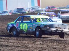 Don't mind the crooked front bumper. Introduced to the frontstretch wall on the car's maiden voyage.  Broken steering u-joint. Never did get it straight. Did sit parallel with the track when cornering, though.
