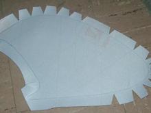 Cut bird-beaks and slits where the vinyl will be curved