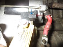 The red arrow shows where the female Lucar terminal fitted to the relay trigger wire gets pushed onto the motor's male. The BLUE arrow shows where I fitted a tiny self tapper through a 2mm hole I drilled through the male and female connectors, to ensure it could not come free accidentally