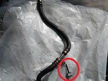 Big circle line to trans line I think as mine was hanging loose. Small circle where you will see tie wrap. Arrow where there was a special electric to metal line clip that was taped to electrical. Didn't reuse any of these. Used two tie wraps to line to secure electrical.