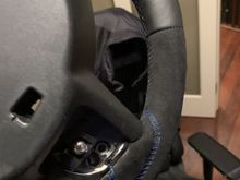 other side of steering wheel with slightly larger paddle shifter screw