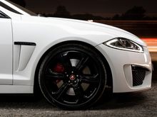 Factory wheels and red calipers