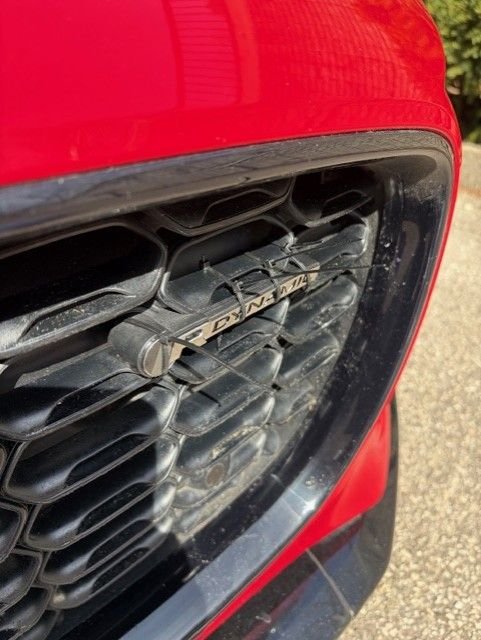 Cable ties looped through the grill and pulled tight to 