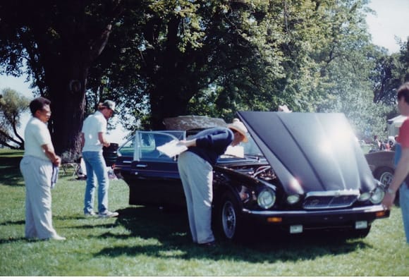 My dad standing to the left with his 1985 Vanden Plas being judged in the Jaguar competition in Dearborn Michigan at the Ford Estate.