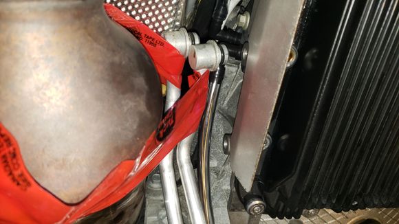 Port connections using 90 degree ploy 3/8 to 1/2 barbs. Lines held back for installation of port fittings by tuck tape. Made fitting installation much easier. Will remove tape before starting procedure because it is attached to exhaust. However, I need to find what is causing the leak before continuing. 