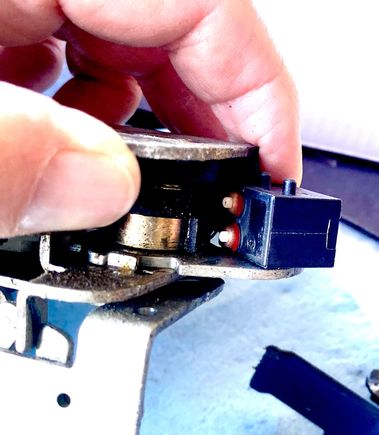 Orientation of the 2 plunger microswitch in the latch. The two plungers contact adjacent cams of different shapes. I don’t know what the cams and switch do. Can anyone tell us what this switch does?