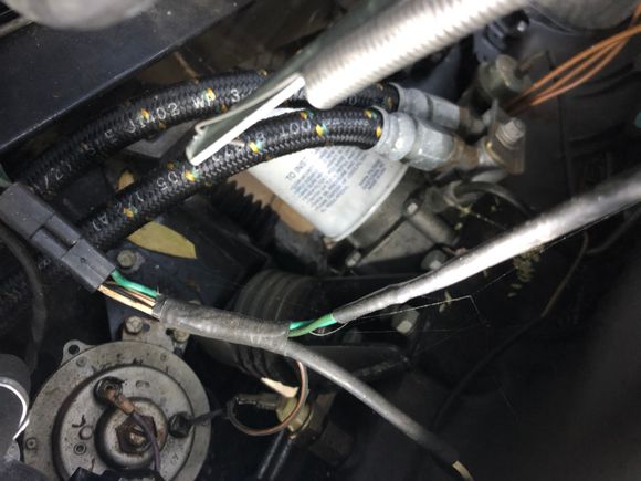 Series III oil filter base modified with hose.  