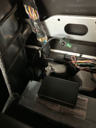 I have a unknown Fakra plug the just ends as in the picture in between the seats.It doesn’t rattle for me but could as it ends just right next to a metal cross brace that runs across the back wall and could transmit a rattle to either side.