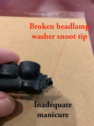 Broken headlamp washer (i.e. ridiculous waste of engineering and production effort) snoot tip.