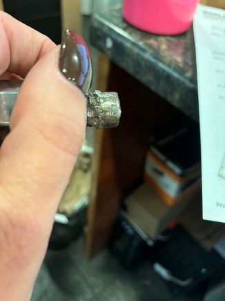 Remains of broken stud that was hack-welded into the rear hub rather than doing the job properly and replacing the hub when the jackass wrench broke it.