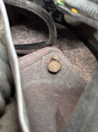 This is the other upper bolt.