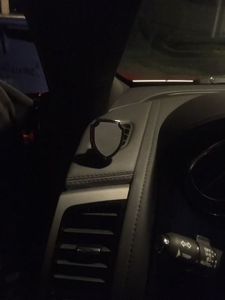 clamp holds magnetic "shield" firmly on dash vent.