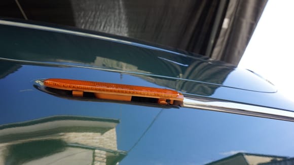 If you squeeze the plastic-clips of the reflectors from behind the bumper as bit (it is not difficult to get there with your arm from underneath the car), it is quite easy to remove them.
