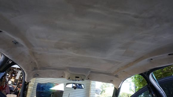 It looks seriously good, this faux suede beige headliner material. After application I obviously had to cut all the required little holes for the bolts to come and the big one for the sun-roof. Leave enough spare material around the sun-roof opening as you will have to fold it up there. It takes a bit of time.
