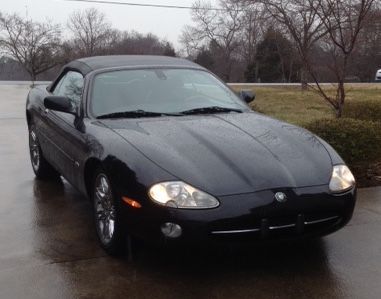 The day I brought her home! Made it Home fine, then first week everything went wrong! Hydraulic rood lines, coolant system, window motor failed, saw tons of paint damage not noticable with rain. Almost sold her! Never buy emotionally, especially in the rain!!!!