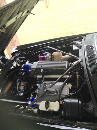 Intercooler pipes all tig welded and powder coated the custom air to water reservoir 3.7 gallons ice/water.