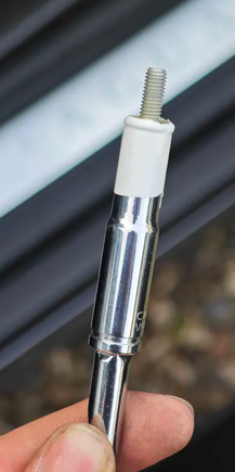 Insulating tape to hold the bolts in the socket while starting them, then tugged the socket off once tight.