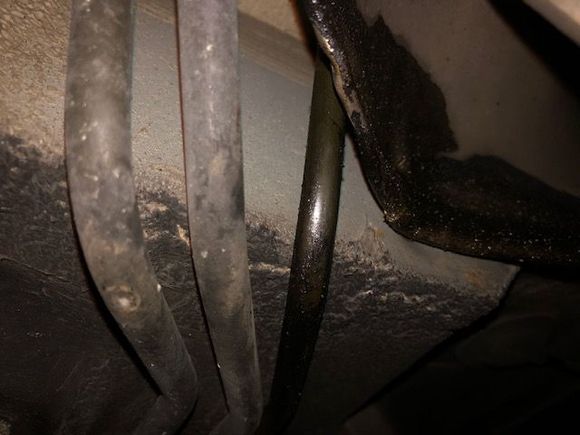 This one is interesting..the small tube on the right side of the photo is  full of oil. this tube is located just forward of the left rear tire.