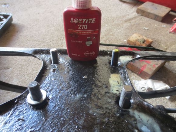 Studs screwed into the diff through the cage