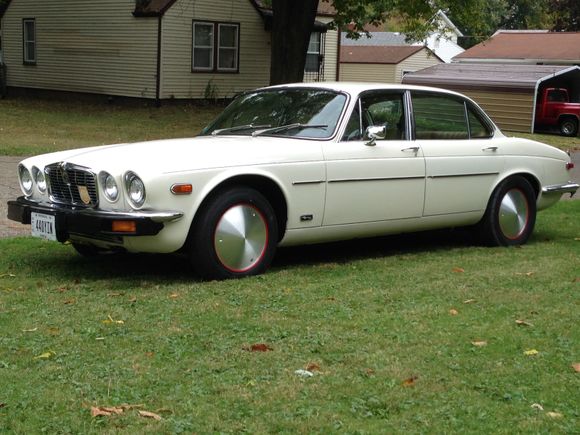 Full Moons with  Dzut's fasteners on red rims.  Rear rims widened for the 235 60 15 Street Slicks