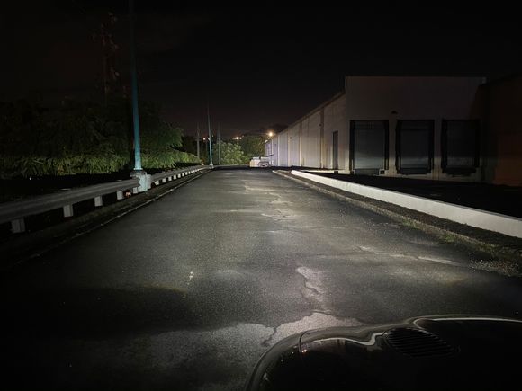 High beams give just that extra bit of light that can be seen in the trees on the far back. 