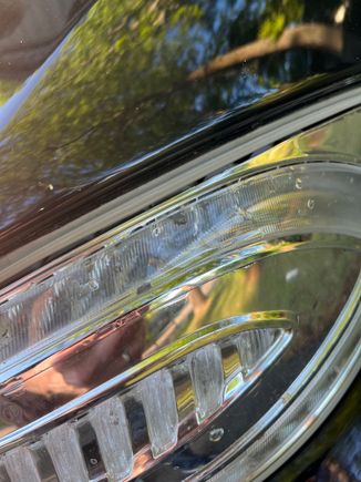 This closeup does show a line of adhesive around the clear layer. 