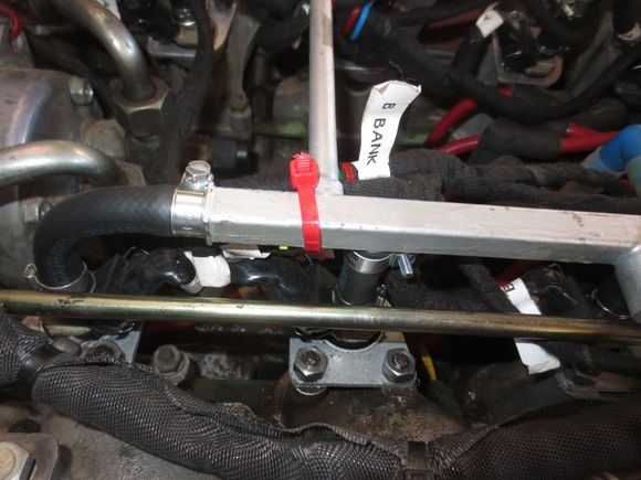 New loom being cable tied to the rail, NOT in the bottom of the V.