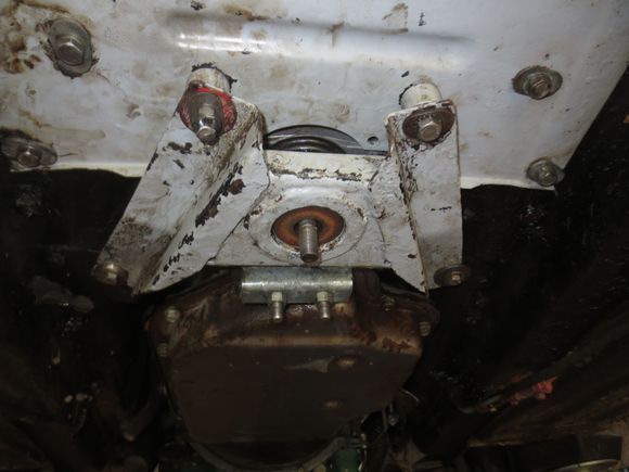 One at a time the rods are removed and replaced by the fixing bolts and spacers at the rear.