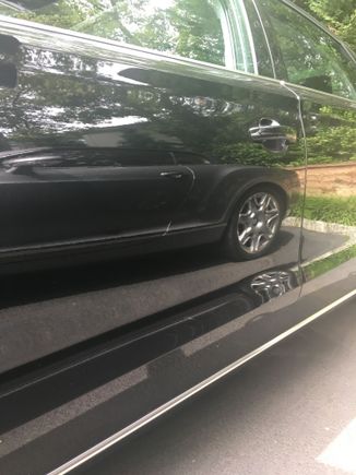You are looking at my Audi A8 front door, that had ceramic applied. The reflection is my Bentley GTC. 