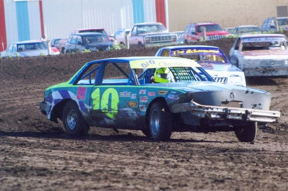 Don't mind the crooked front bumper. Introduced to the frontstretch wall on the car's maiden voyage.  Broken steering u-joint. Never did get it straight. Did sit parallel with the track when cornering, though.