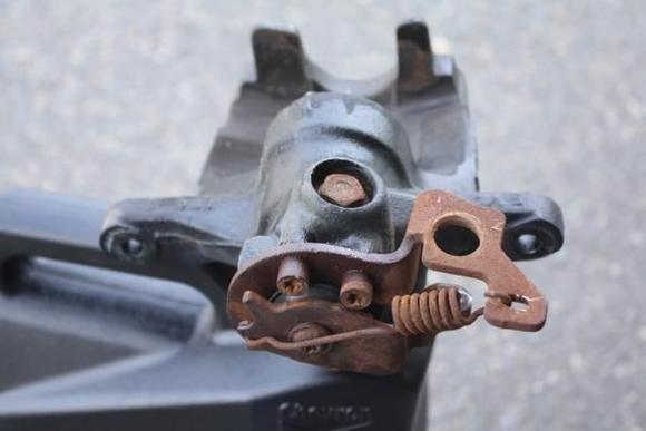The start of the rebuild.  Underneath shot.  Notice the 5 point (14mm) bolt.  You will need to remove this later.  Requires a special (pentasocket) socket.