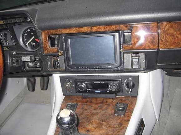 This shows the custom dash with 7&quot; touchscreen, and better shows the DVD drive (directly below the stereo) for the on-board PC in the donor car. All of this either has been, or is being transferred to JagZilla.